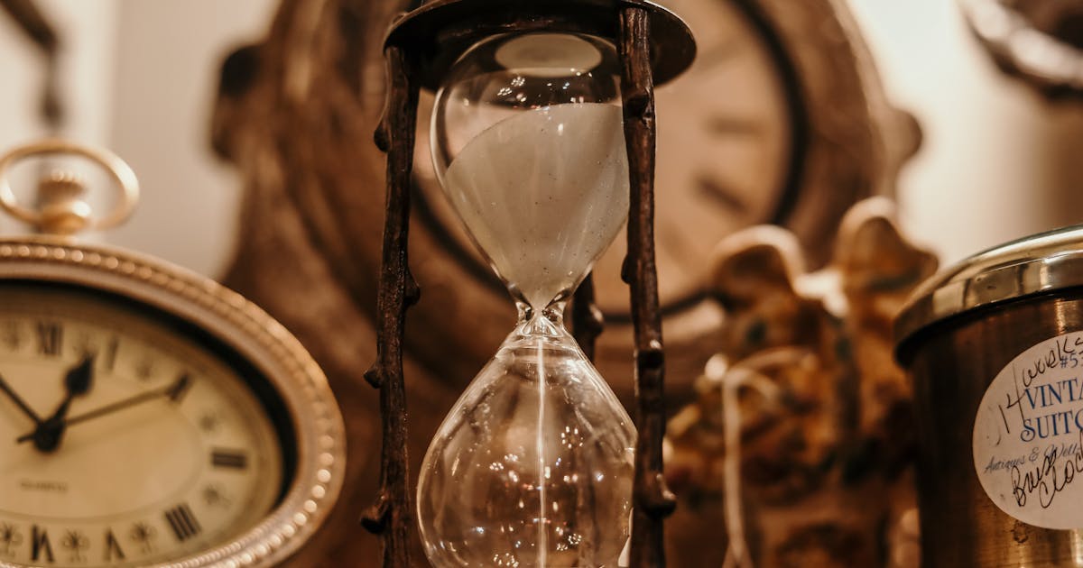 Hourglass on a desk — time slipping away during procurement